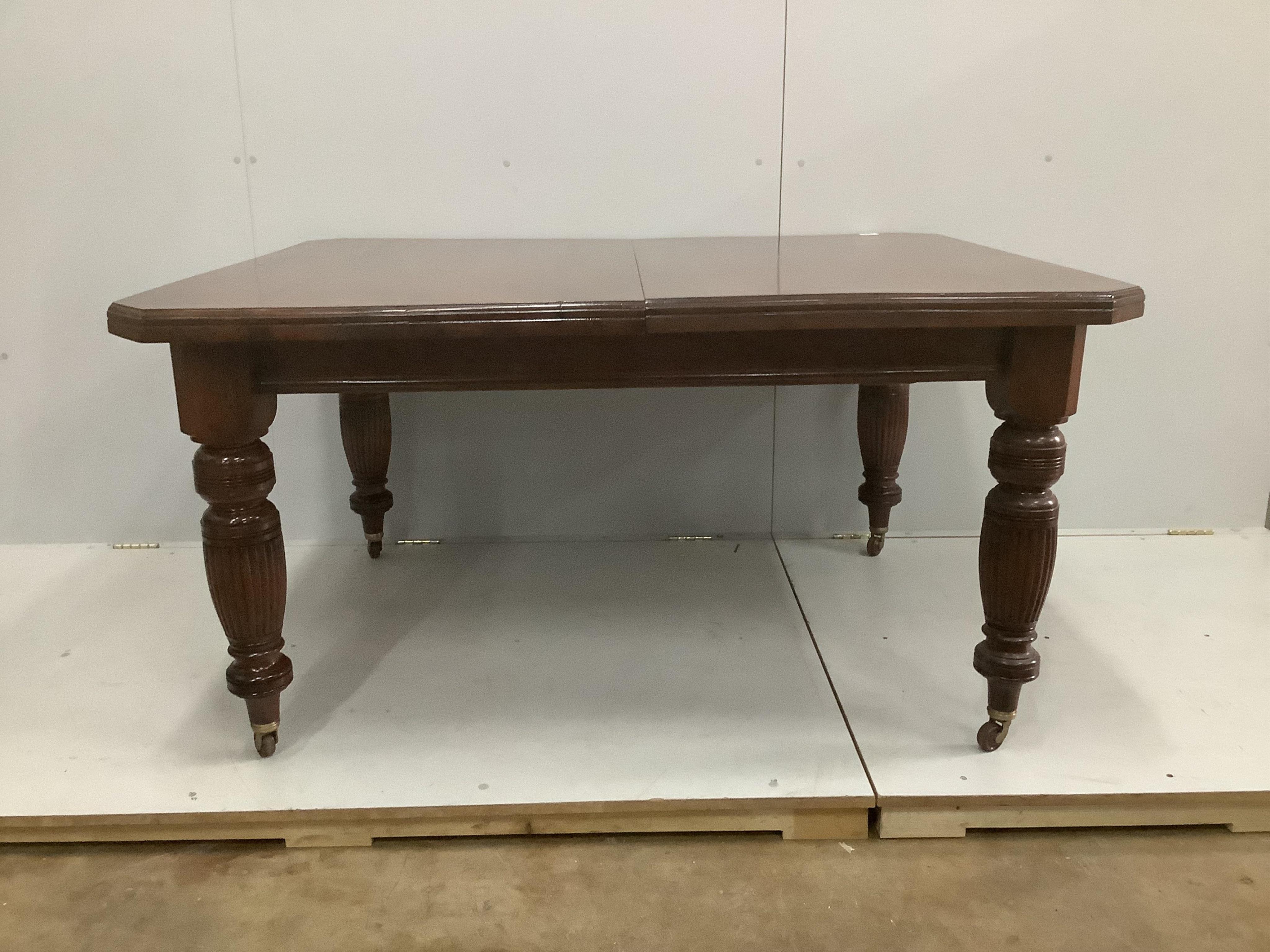 A late Victorian walnut extending dining table, width 232cm extended, two spare leaves, depth 118cm, height 73cm. Condition - good